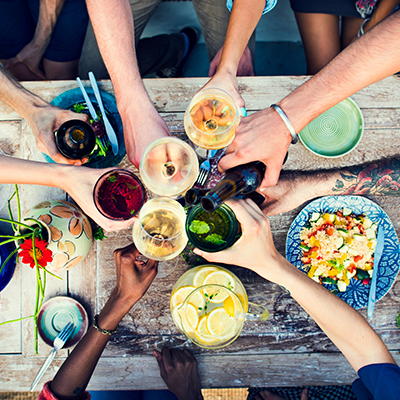 A top down view of friends toasting glasses