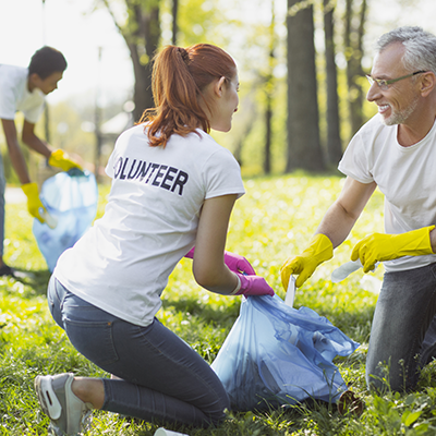 Image of two people working as volunteers